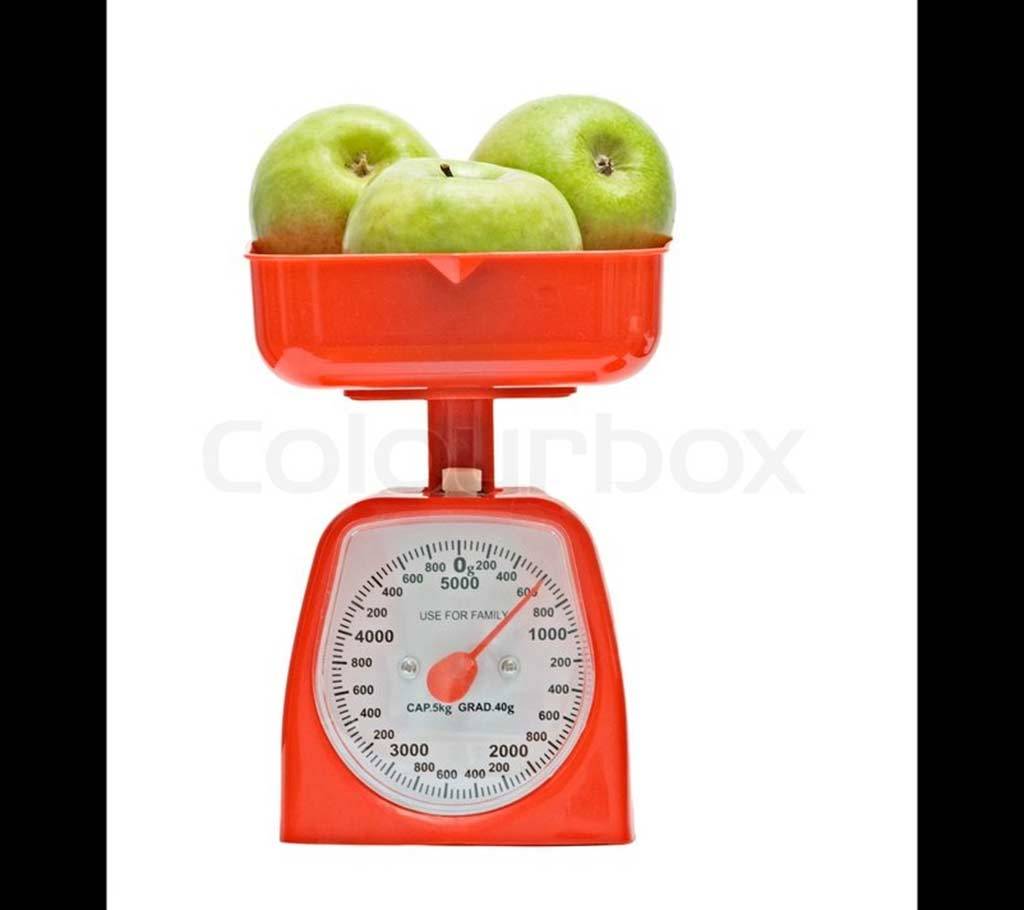 Red kitchen scale weighting nectarines বাংলাদেশ - 629377