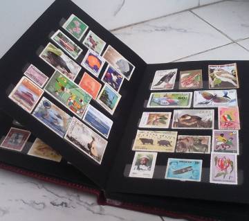 200 New Stamps with Album