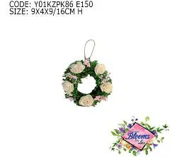 WHITE ROSES AND PINK FLOWERS IN A WREATH