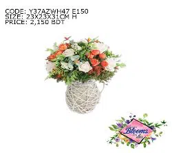 RED AND WHITE ROSES MIXED WITH DRIED FLOWERS AND LEAVES IN A PLANTER