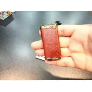 Metal body gas lighter with leather cover
